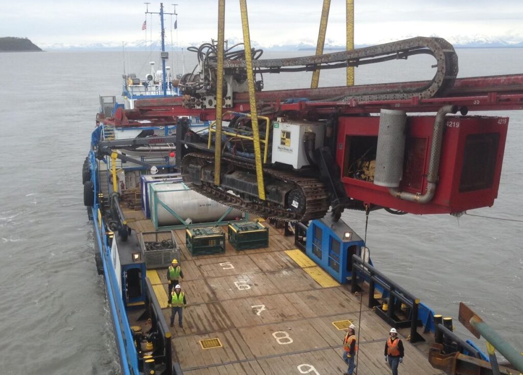 Horizontal directional rig being moved on tanker